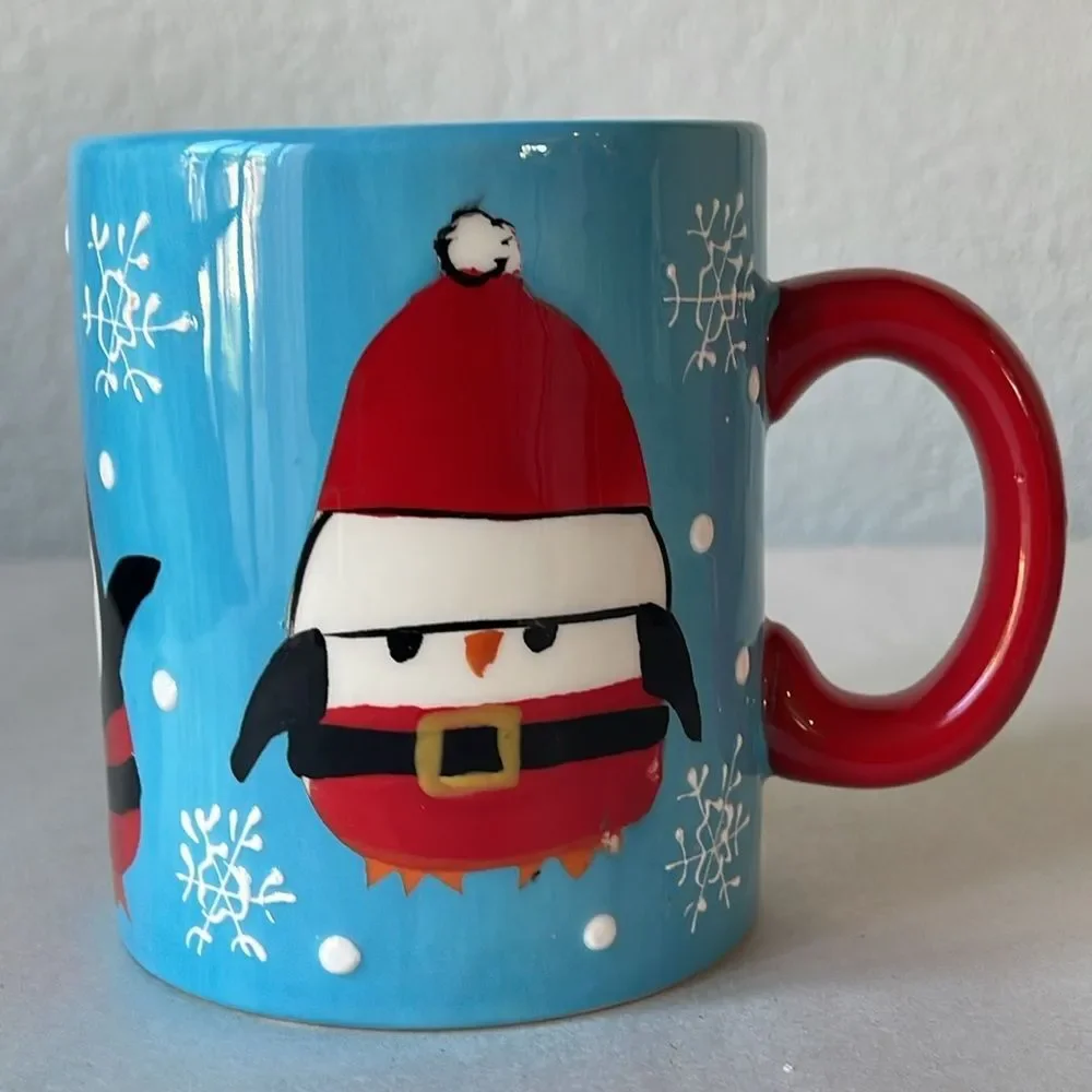 Pier 1 Penguin in Santa Outfit Blue Coffee Mug.
